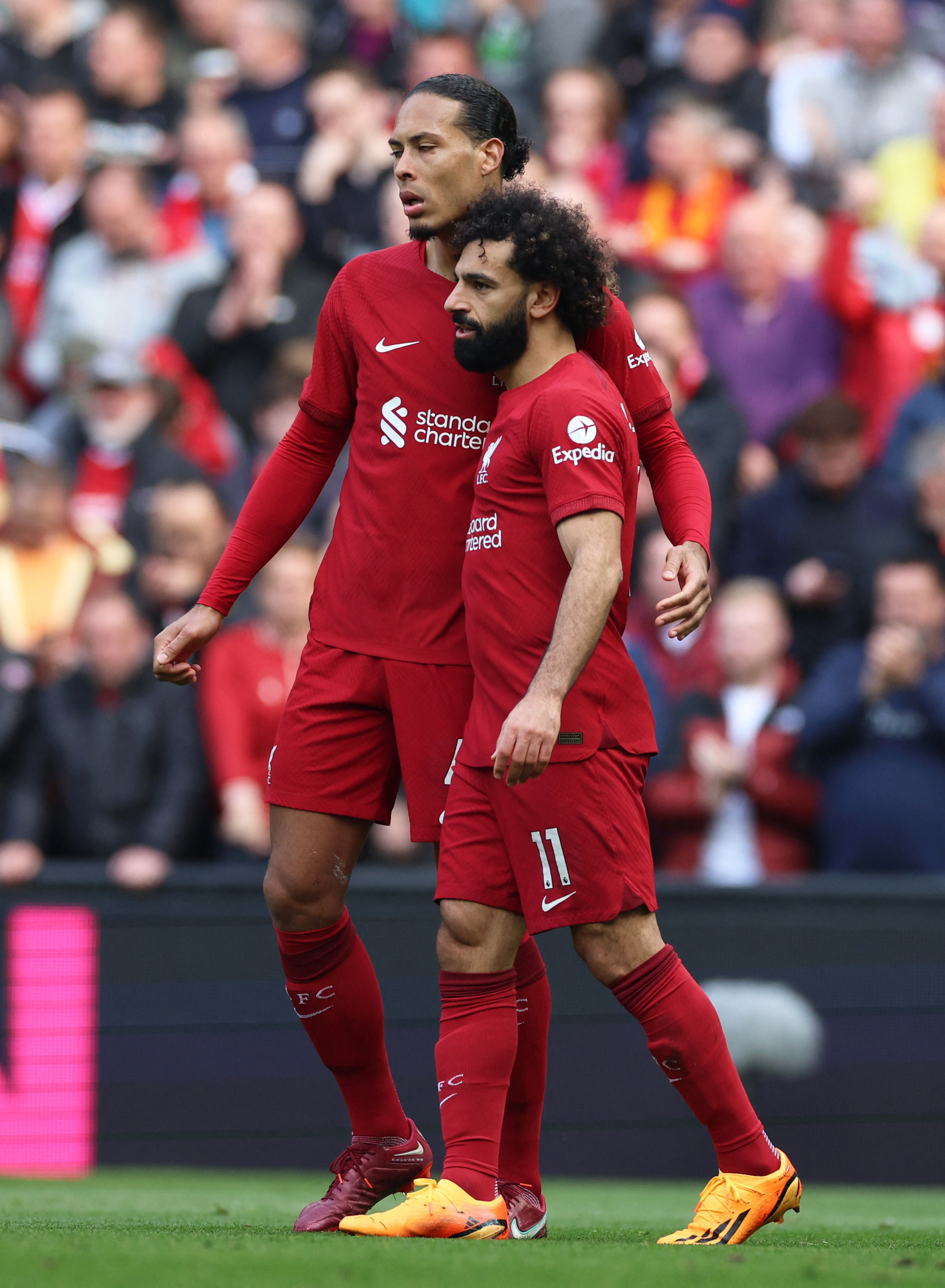Liverpool's Mohamed Salah celebrates scoring their third goal with teammate Virgil van Dijk REUTERS/Phil Noble