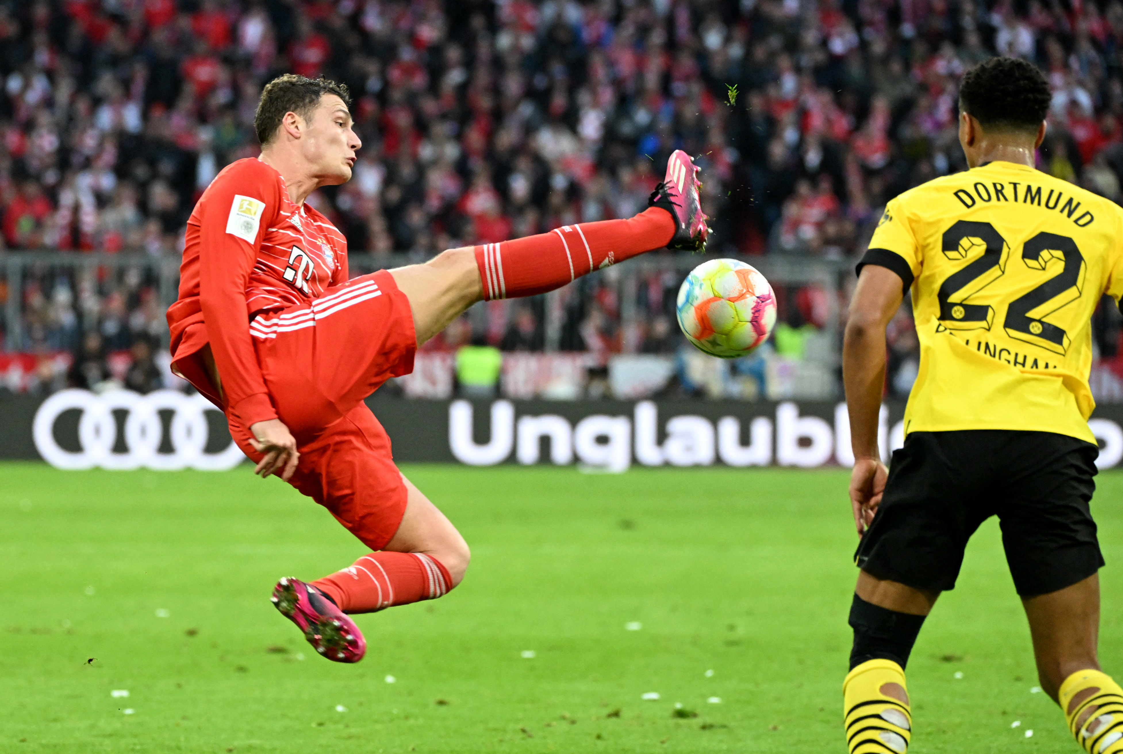 Bayern Munich's Benjamin Pavard in action with Borussia Dortmund's Jude Bellingham REUTERS/Angelika Warmuth